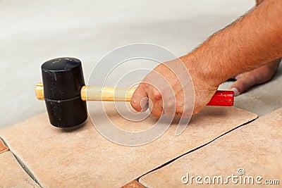 Phases of installing ceramic floor tiles Stock Photo