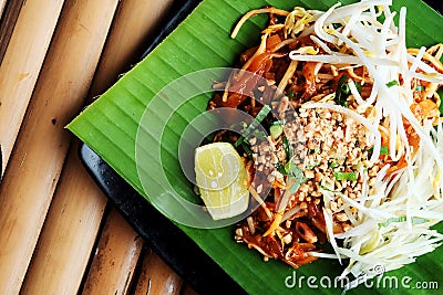 Phat thaior Pad thai is a famous Thailand tradition cuisine with fried noodle served on banana leaf Stock Photo