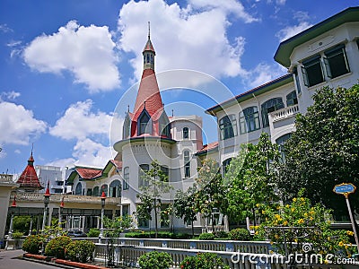 Phaya Thai Palace is on the banks of the Samsen Canal with beautiful green grass field in the Ratchathewi District of Bangkok. Editorial Stock Photo