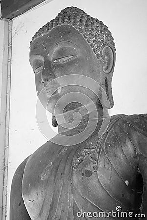 Portrait Black and White Zoom View Front Left Buddha Statue in Sanctuary Editorial Stock Photo