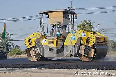 Zoom Back View Worker and Road Roller on Asphalt Road Editorial Stock Photo