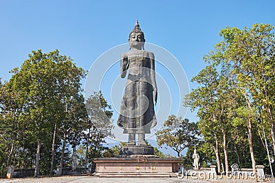 Wide Angle Front Buddha Pacifying Relatives Statue on Blue Sky Background Editorial Stock Photo