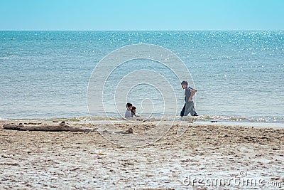 PHETCHABURI-THAILAND,DECEMBER 31 ,2022 : Unidentified Three Asian boys from same family having fun together playing in the sea Editorial Stock Photo