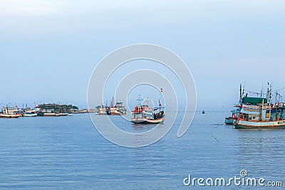 PHETCHABURI-THAILAND,OCTOBER 23, 2022 : Beautiful scenic of variety colorful fishing boats at pier with seaview in evening at Phoo Editorial Stock Photo