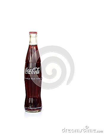 Phichit, Thailand - September 2019: A glass bottle of Coca-cola drink over white Editorial Stock Photo