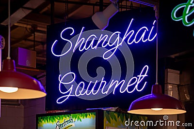 Hanging neon sign for Shanghai Gourmet at the historic Reading Terminal Market, an Editorial Stock Photo