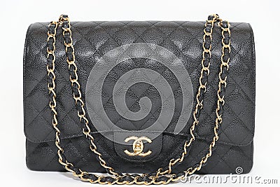 Photo of black Chanel handbag brand Editorial on white background. Editorial Stock Photo