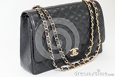 Photo of black Chanel handbag brand Editorial on white background. Editorial Stock Photo