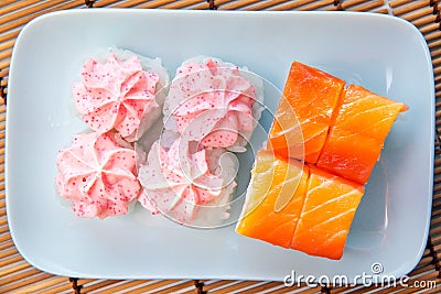 Philadelphia Roll with cream cheese, wrapped with fresh salmon plastics top view, lava roll, pink filling Stock Photo