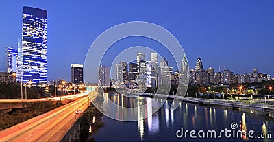 Philadelphia skyline illuminated and reflected into Schuylkill River at dusk Stock Photo