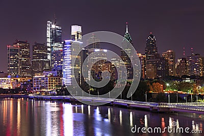 Philadelphia skyline illuminated and reflected into Schuylkill River at dusk Stock Photo