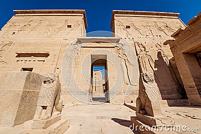 Philae Temple entrance guarded by two lion statues in Egypt Stock Photo