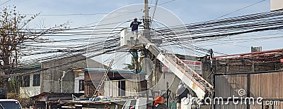 A Philippine Electrician Fixing Wires Editorial Stock Photo