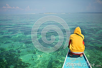 Philippino man on a nose of bangka boat Stock Photo