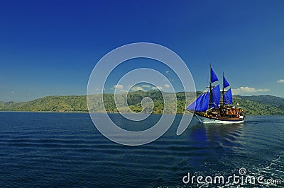 Live board Phinisi Bugis traditional boat cruise around Komodo Islands in Indonesia. Stock Photo
