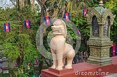 A lion statue or leogryph at the steps of the main stupa of Wat Editorial Stock Photo