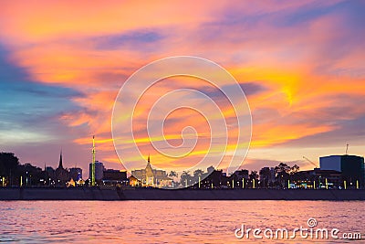 Phnom Penh skyline at sunset capital city of Cambodia kingdom, panorama silhouette view from Mekong river, travel destination, Stock Photo