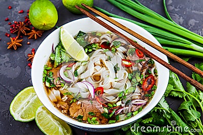 Vietnamese Beef Noodle Soup Pho Bo with beef on dark background Stock Photo