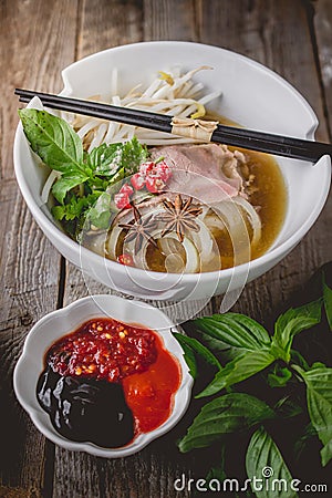 Pho Vietnamse Noodle Soup on Old Wood. Image for Food Advertise Stock Photo