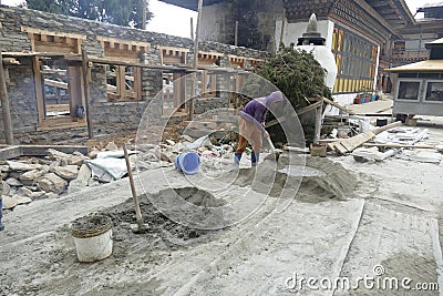 Workers restoring cells of the Gangtey Gompa Editorial Stock Photo