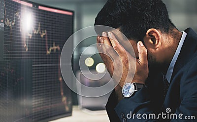 The phoenix must burn to emerge. a young stock market expert looking stressed out at work. Stock Photo