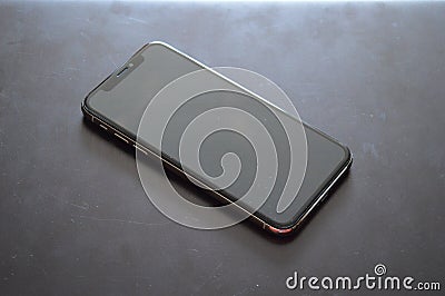 Phone on a black background, successful life Stock Photo