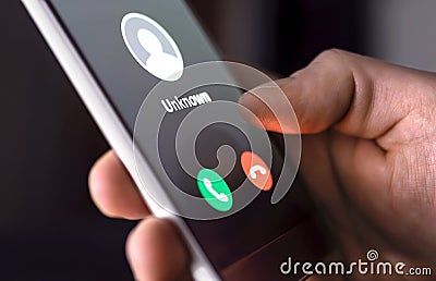 Phone call from unknown number late at night. Scam, fraud or phishing with smartphone concept. Prank caller, scammer or stranger. Stock Photo