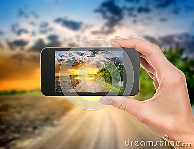 Phone and evening landscape Stock Photo