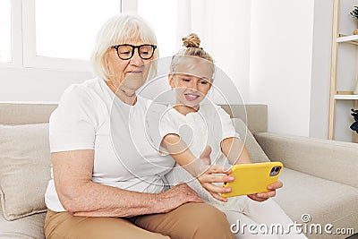 Phone grandmother family hugging child Stock Photo