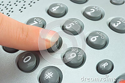 Phone keypad and woman finger Stock Photo