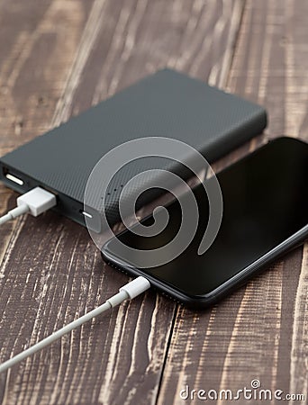 Phone mobile connect to battery power reserves side view Stock Photo