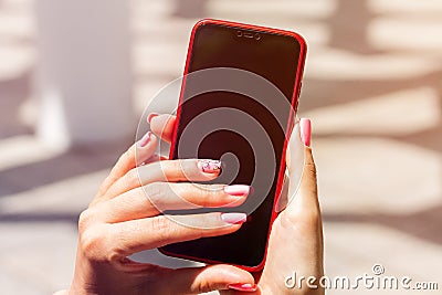 Phone in a woma hand Stock Photo