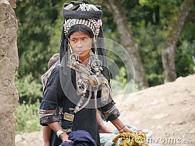 Phongsaly, Laos - november 2, 2019: portrait young Akha woman wearing traditional clothings belonging to minority ethnic group Editorial Stock Photo