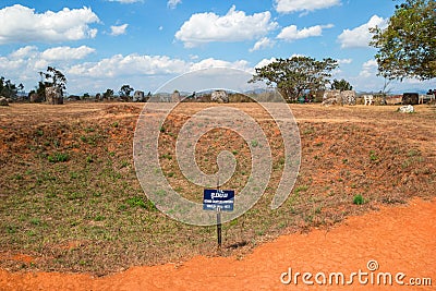 Phonsovan, Xieng Khouang Province, Laos - January 28, 2018: Bomb crater near to unique archaeological site Plain of Jars Editorial Stock Photo