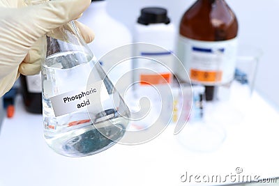 Phosphoric acid in glass, chemical in the laboratory Stock Photo