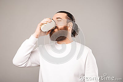 Phot of tired office worker man drinking cup of coffee for more cafeine Stock Photo
