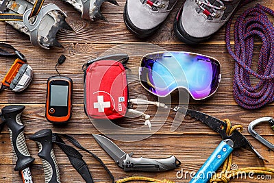 Photo from above of ski poles, boots, pickaxe, first aid kits, masks Stock Photo