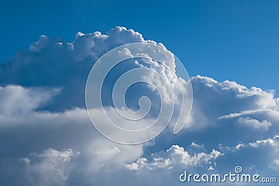 Aerial view from airplane of rain clouds and blue sky Stock Photo