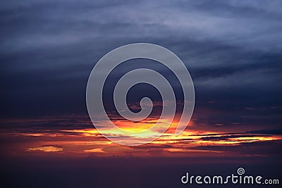 Aerial view from airplane of rain clouds and blue sky in twilight Stock Photo