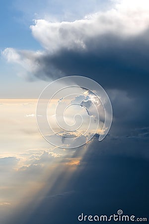 Aerial view from airplane of rain clouds and blue sky in twilight Stock Photo