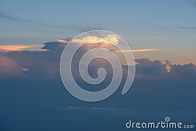 Aerial view from airplane of rain clouds and blue sky in twilight Stock Photo