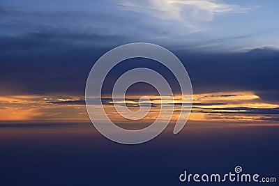 Aerial view from airplane of rain clouds and blue sky in twilight Stock Photo