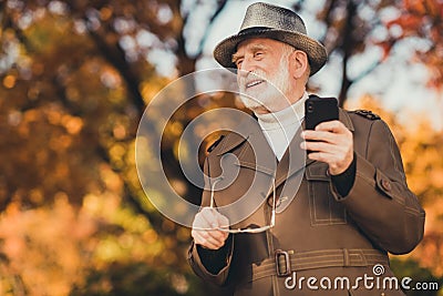 Photo of aged funny white hair grandpa hold specs telephone see grandchildren family take off specs glad meet gathering Stock Photo