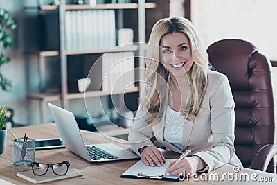 Photo of amazing blond business lady notebook table signing contract important partner prepared documents sitting chair Stock Photo