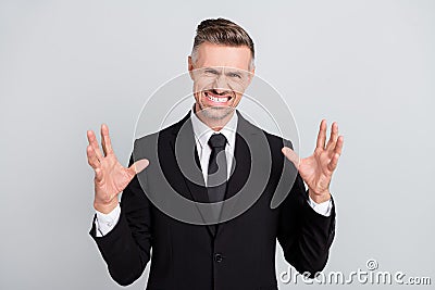 Photo of angry furious mature broker dressed black suit rising arms hands screaming isolated grey color background Stock Photo