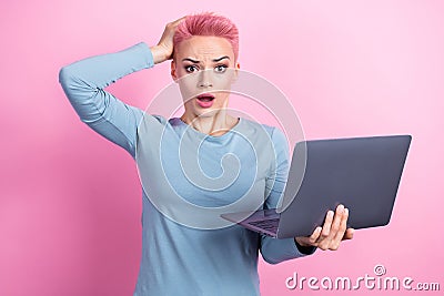 Photo of anxious embarrassed lady wear blue stylish clothes use netbook oops error mistake omg reaction isolated on pink Stock Photo