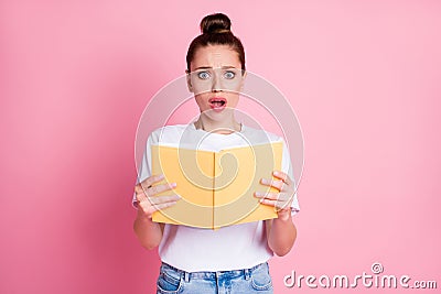 Photo of astonished horrified girl feel fear read book impressed wear stylish trendy white outfit isolated over pastel Stock Photo