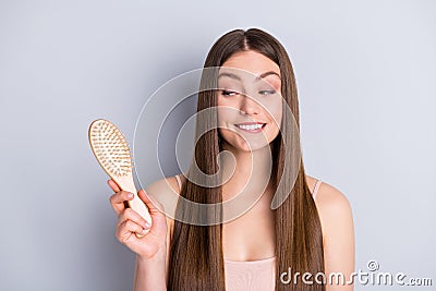 Photo of attractive cute perfect appearance model lady demonstrating ideal neat long hairstyle hold wooden comb tricky Stock Photo