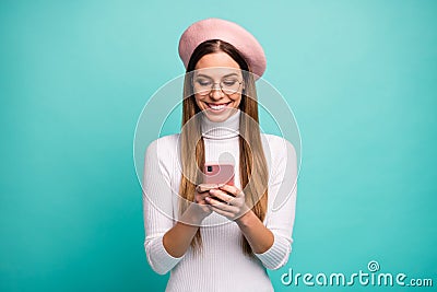 Photo of attractive lady hold telephone hands reading new post instagram likes wear specs modern pink beret cap white Stock Photo