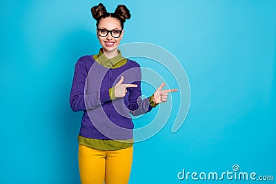 Photo of attractive pretty student lady two funny buns direct fingers side empty space showing novelty wear specs shirt Stock Photo